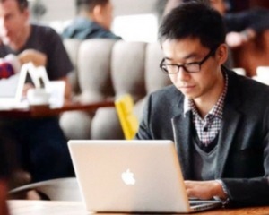 JP in front of Mac computer